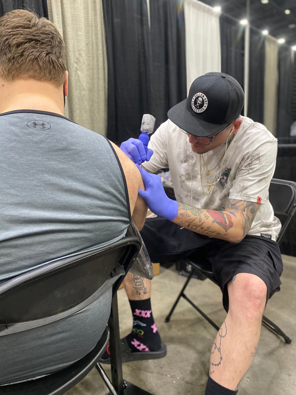 Licensed Tattoo Artist Nick Young tattooing a convention client during the 3rd Annual Cincinnati Villain Arts Tattoo Convention hosted at the Duke Energy Center 